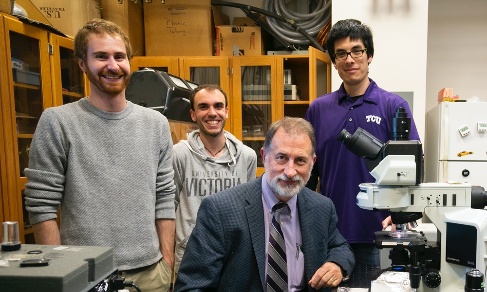 faculty with students doing research