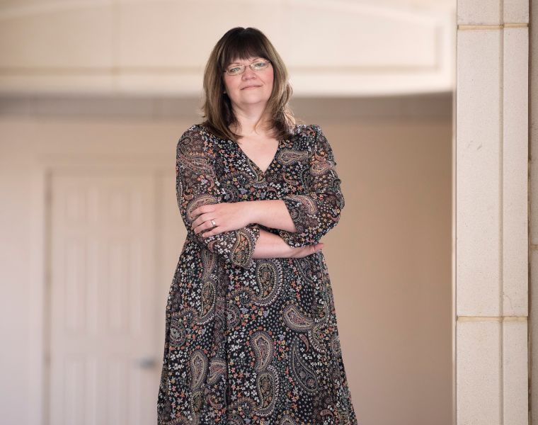 Cathy Cox stands on campus. 
