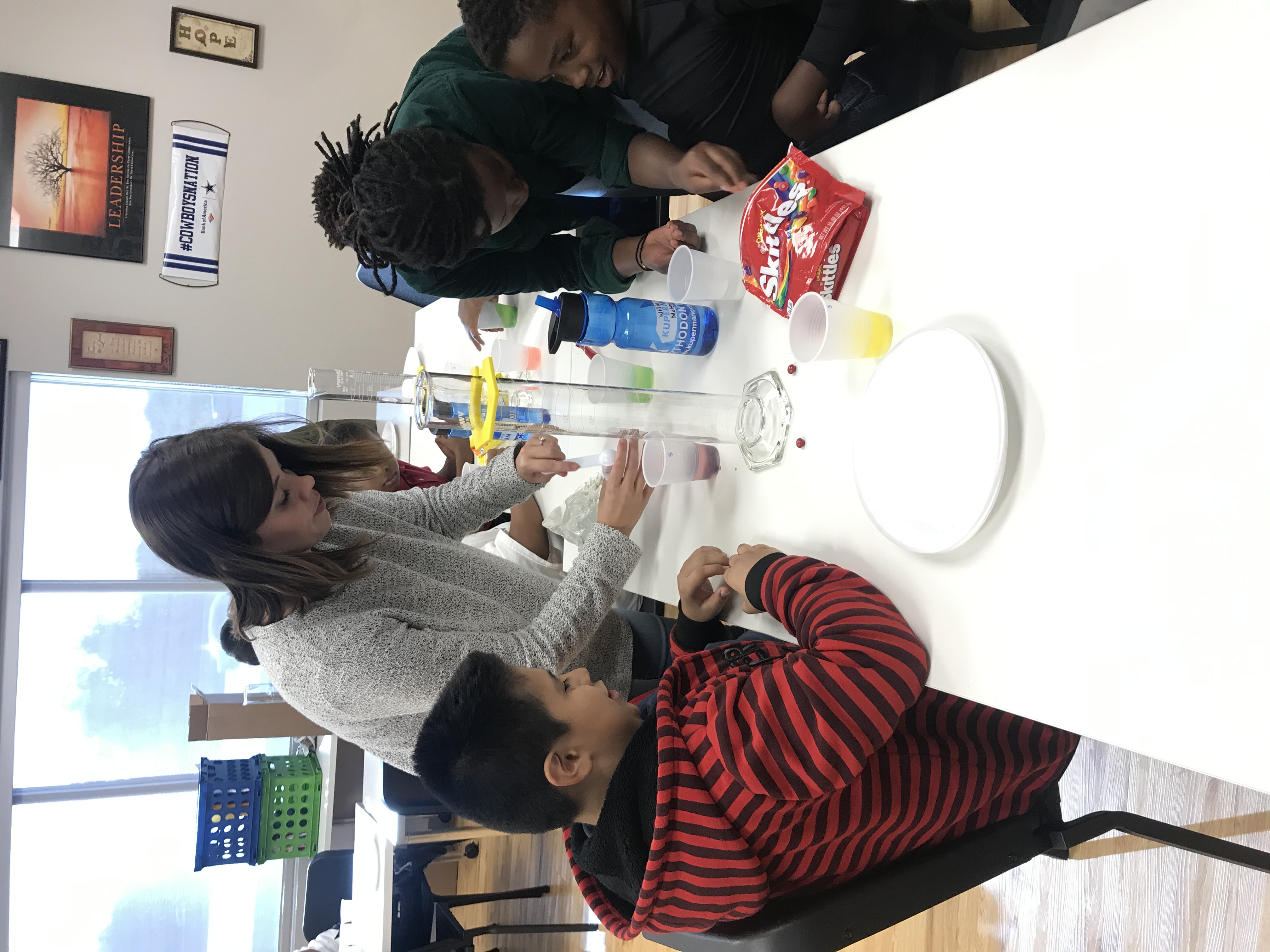Young students work on projects on a work table