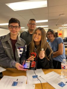 Pascal students holding electronics