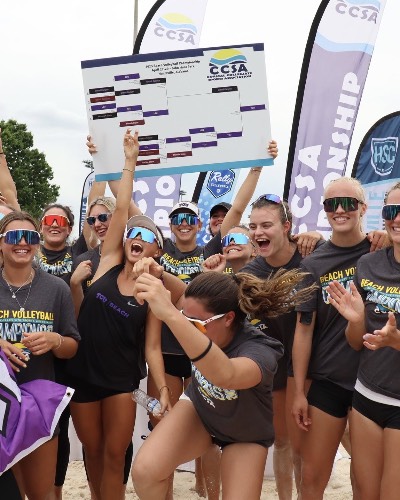 TCU Beach Volleyball team celebrating a win at CCAS.